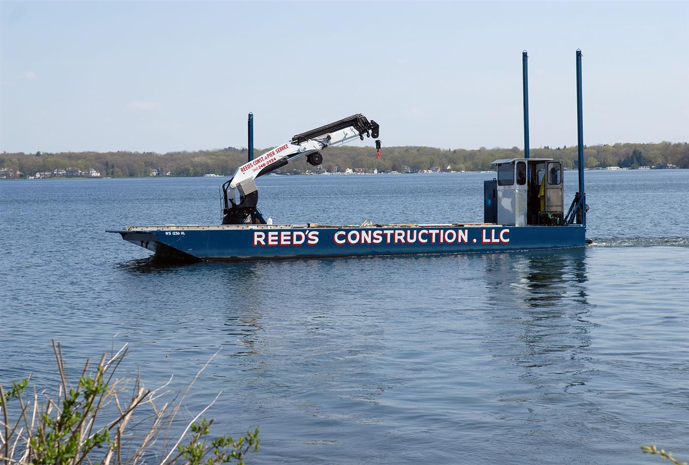 Reed's Construction crane barge working on Geneva Lake