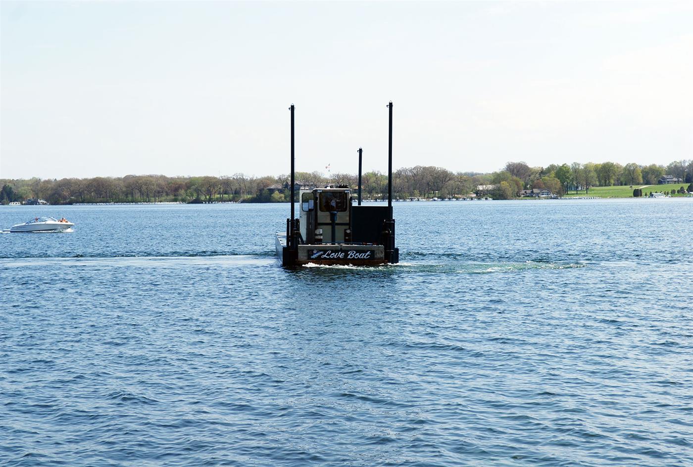 Reed's Construction barge under way on Geneva Lake