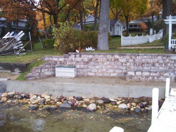 Cement seawall rebuild in progress at the waterline